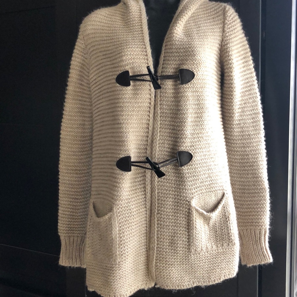 Cable-knit sweater cardigan.
